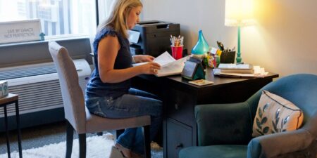 Aimee working at her desk.